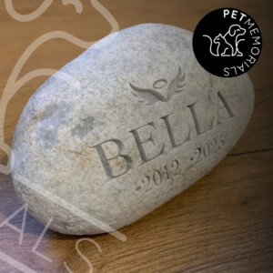 Engraved river stone pet memorial with name, angel wings and dates