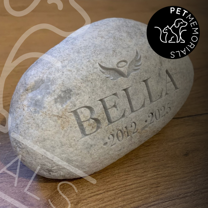 Engraved river stone pet memorial with name, angel wings and dates